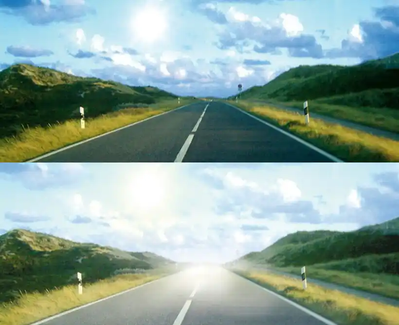 Landstraße mit Wiesen links und rechts unter freiem Himmel in ruhiger Landschaft